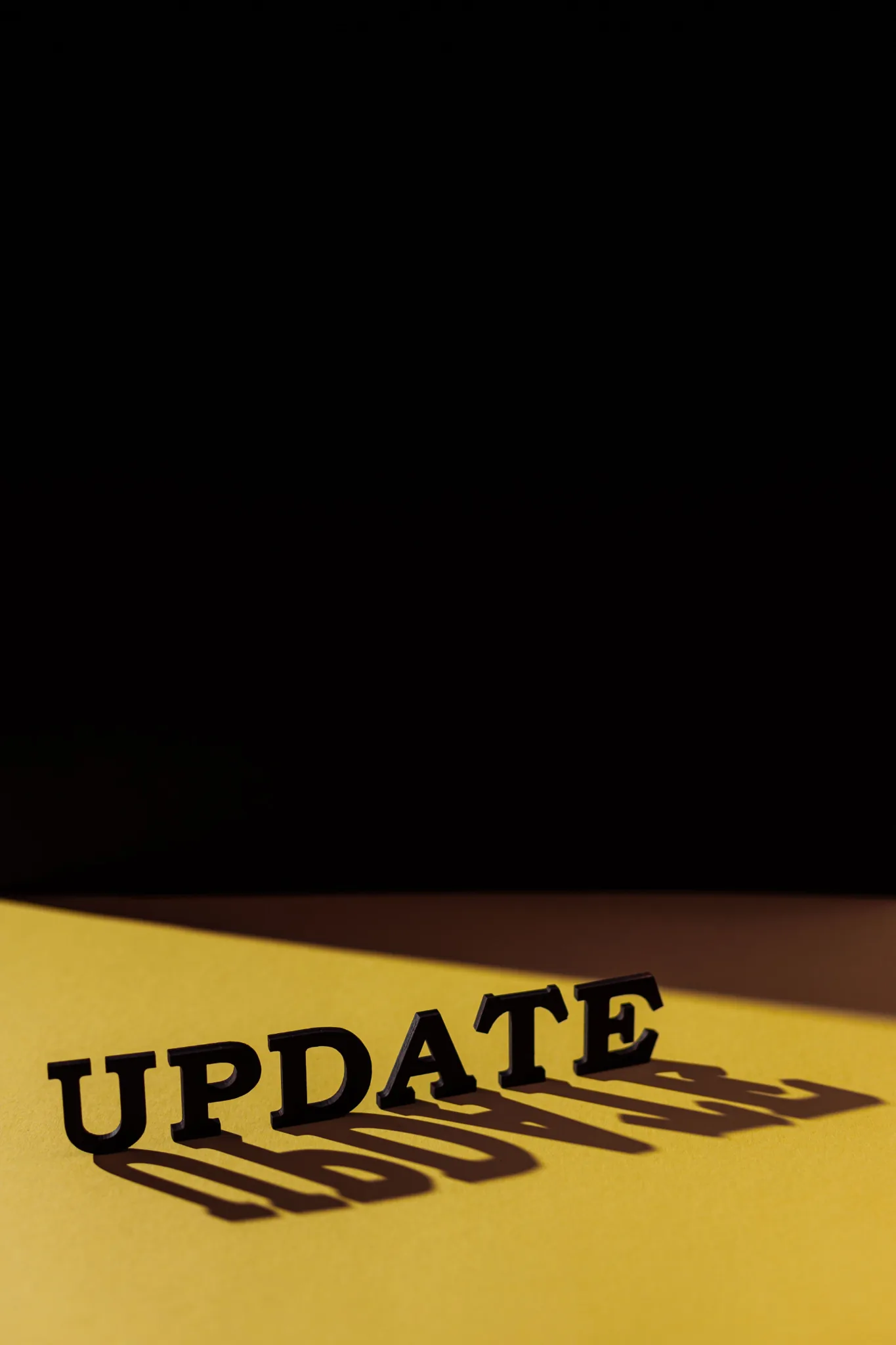 The word Update on a yellow surface.
